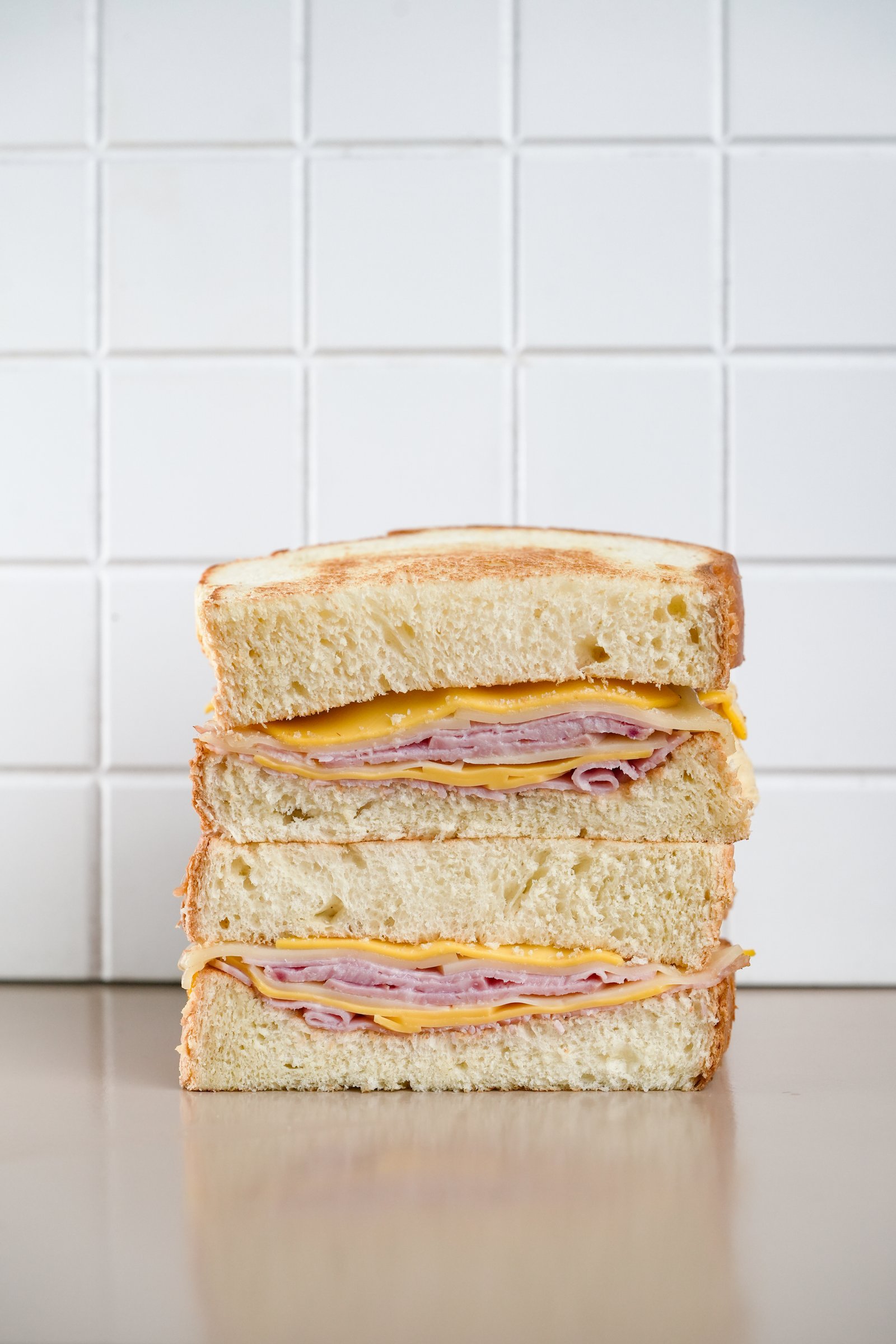 American Ham & Cheese — white toast, smoked ham, yellow cheddar, swiss cheddar, unsalted butter